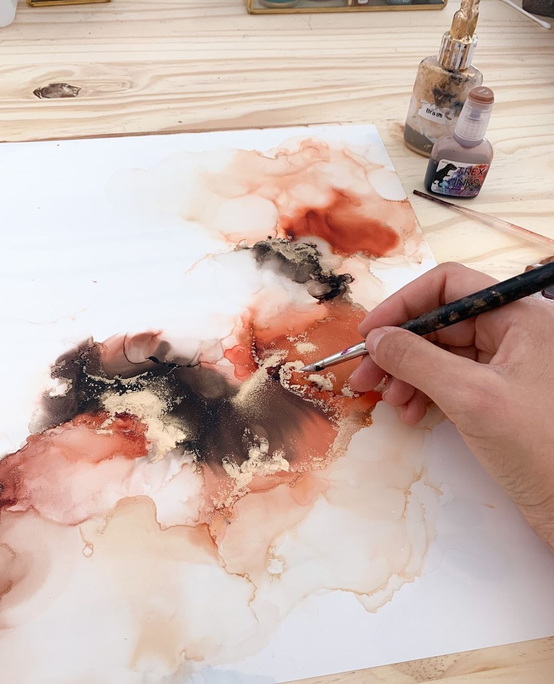 Hand painting abstract alcohol ink art in brown black tones using t-rex inks for alcohol ink painting tutorial