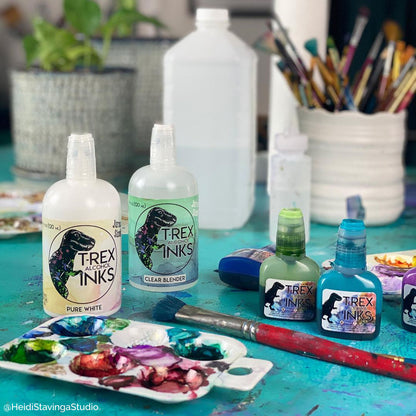 Jurassic sized 4oz PURE WHITE T-Rex Alcohol Ink bottle with applicator tip alongside clear blender and other vibrant inks